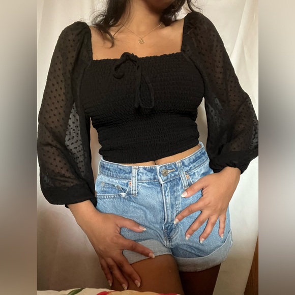Black crop top. Very soft and had bubble sleeves that are see throught. - Picture 4 of 7